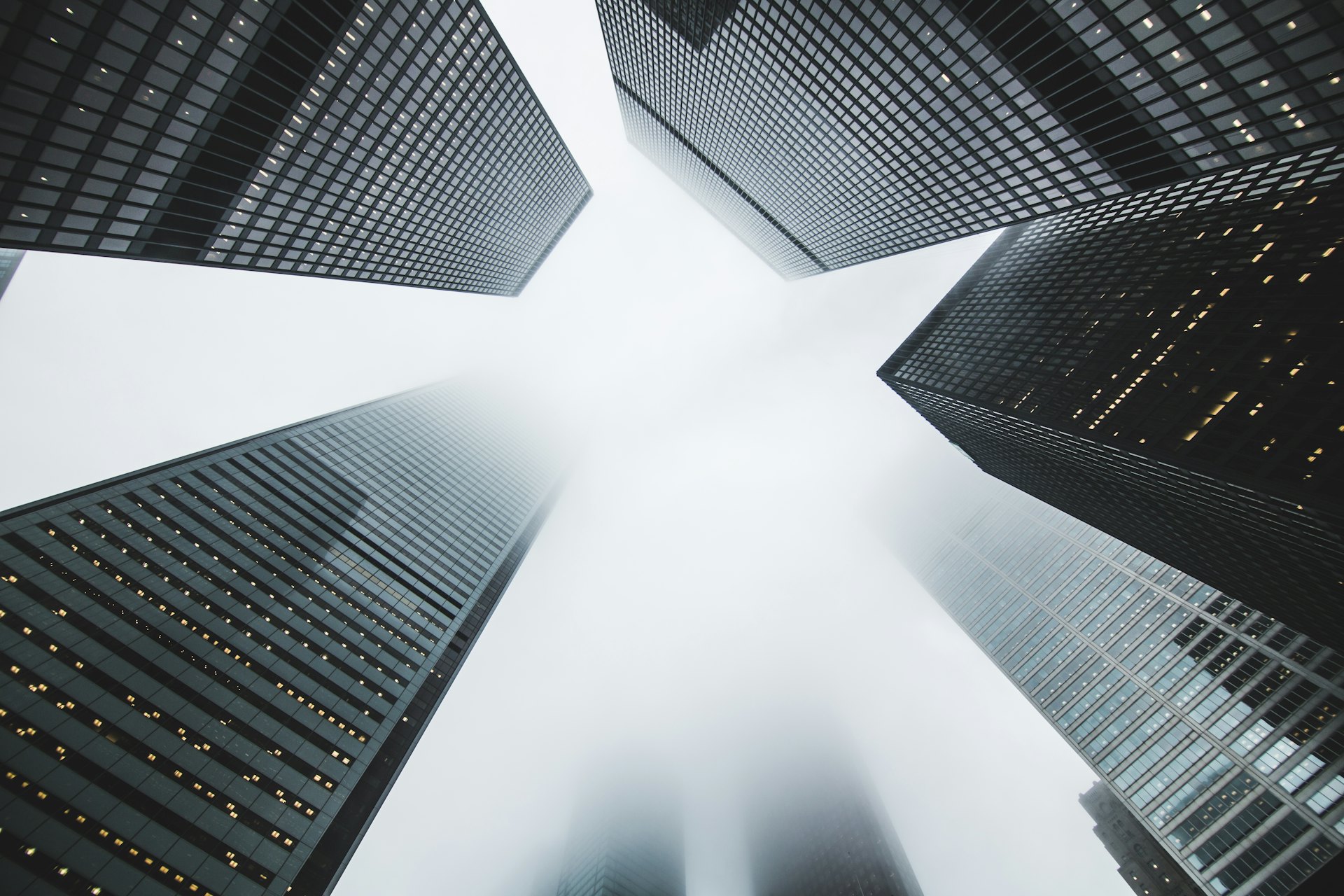 Skyscrapers viewed from below against a bright sky